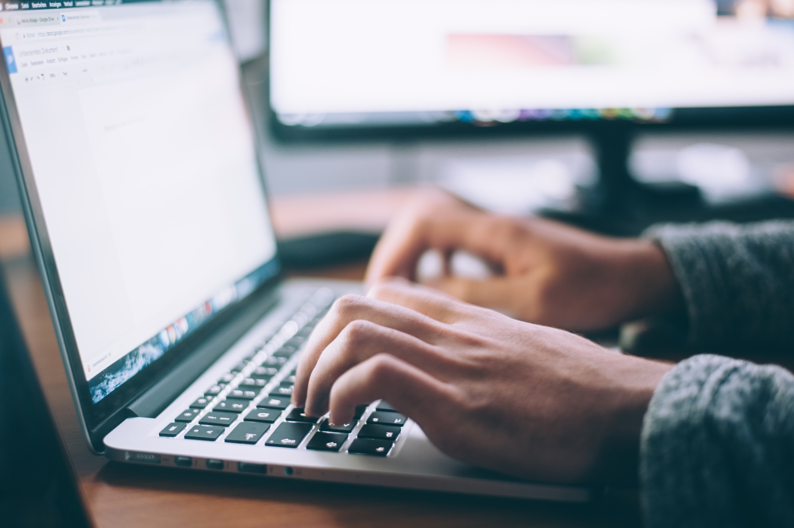 glenn-carstens-peters-npxXWgQ33ZQ-unsplash Person typing information on a laptop keyboard