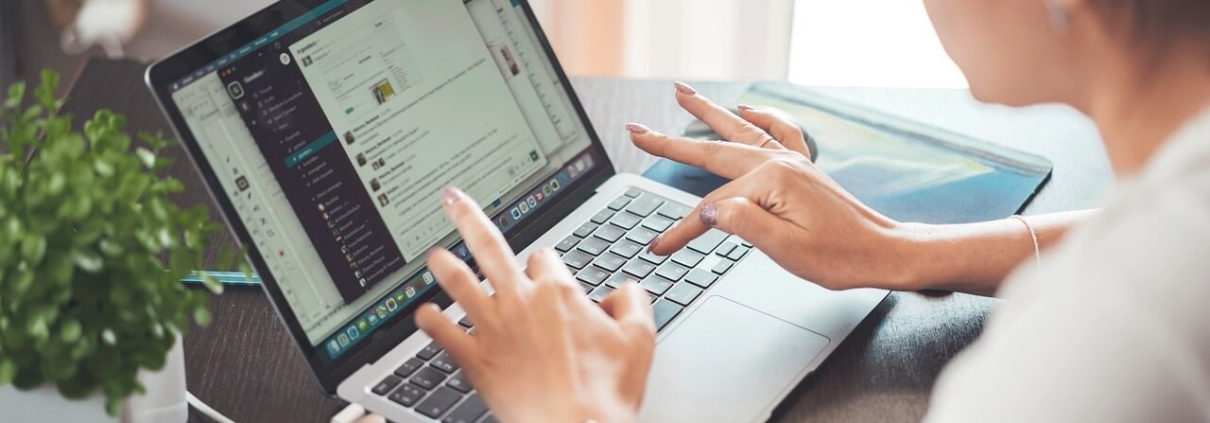 Woman using laptop for product data