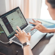 Woman using laptop for product data