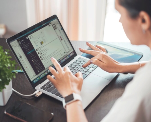 Woman using laptop for product data