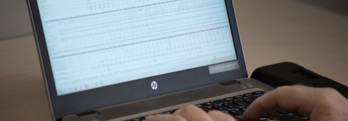 Spreadsheet showing product data on a laptop