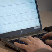 Spreadsheet showing product data on a laptop